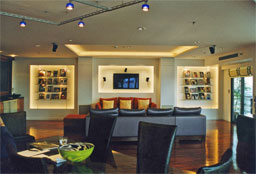 Dimmers control the recessed lighting in a Luxury Home Cinema