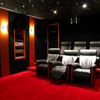 Wood and leather paneled home cinema with scene dimmer